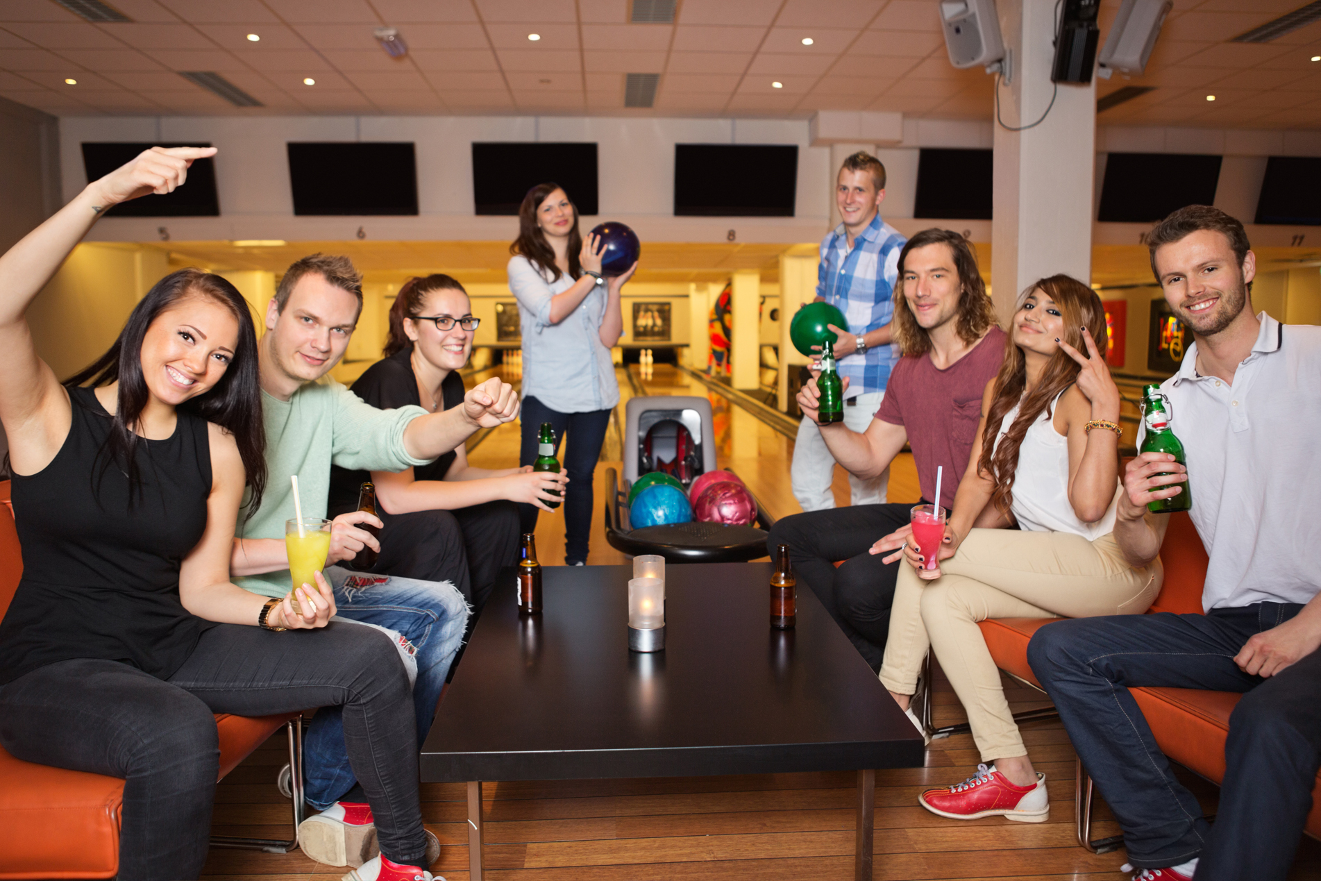 Group of friends at the bowling center having a good time